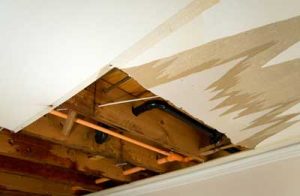 When removing water-damaged building materials, a professional will be careful to not damage components like plumbing and electrical lines.